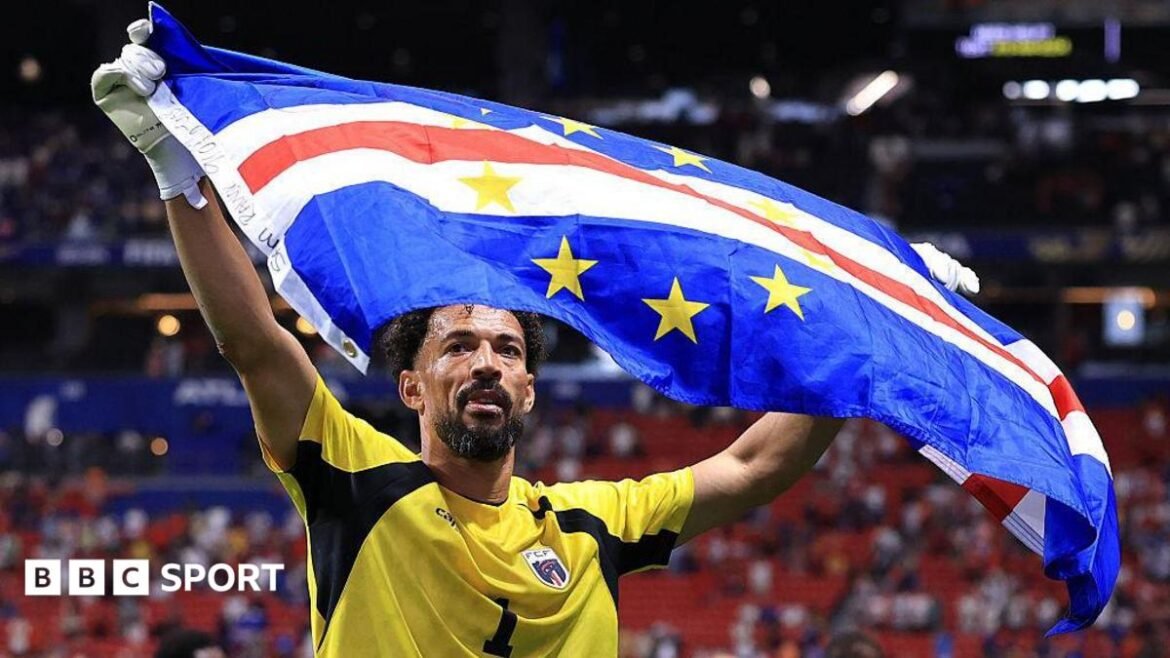 Image of Vozinha raising the Cape Verde flag after their draw against Spain
