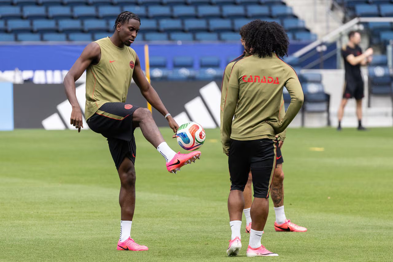 A football player is training on the field.