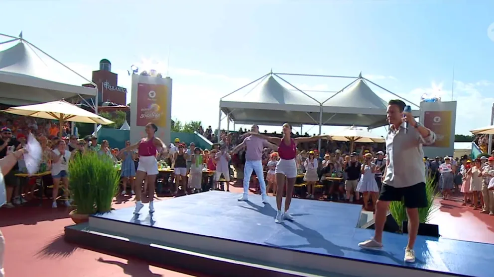 Full dedication: Mross and his guests perform under the scorching sun