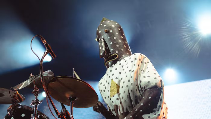 The musician plays the drums. 