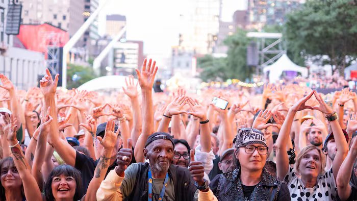 Thousands of people, hands up. 