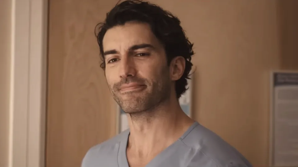 Ryle Kincaid (Justin Baldoni) looks at Lily Bloom and his child in It Ends With Us.
