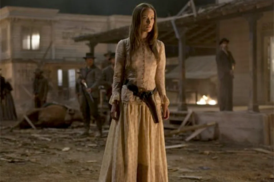 Wilde portrayed a mysterious woman who arrived in the Arizona Territory in Cowboys and Aliens (2011) (Universal).