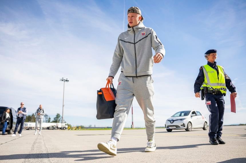 Football star's Birkin collection turns heads at World Cup 15 Haaland with an orange and black Hermes HAC while traveling with the Norway national football team on October 12, 2024 at Linz Airport.