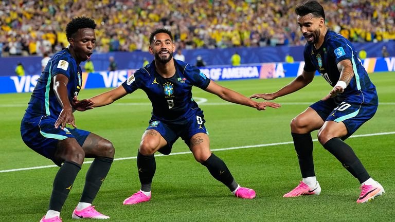 Brazilian Matheus Cunha (9) celebrates after scoring his second goal for his team, along with Brazilian Vinicius Junior (7) and Lucas Paqueta (20) 