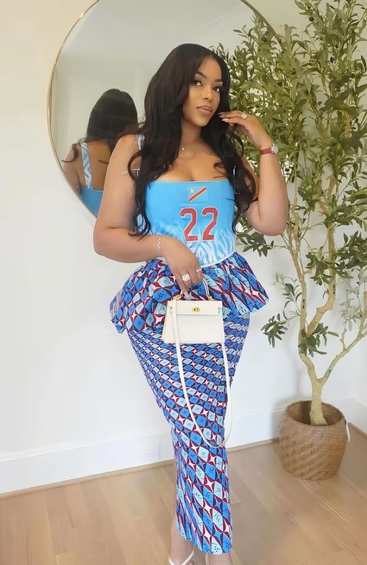 DR Congo captain's stunning WAG turns heads ahead of England World Cup match 17 Her custom top made a splash
