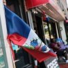Haitian flags are displayed in front of a store in the Little Haiti neighborhood.
