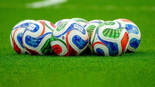 Several World Cup balls on the lawn