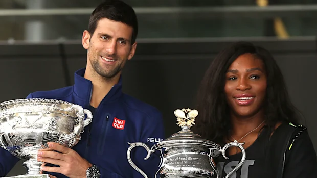 Djokovic and Williams pose with the 2016 Australian Open trophies.