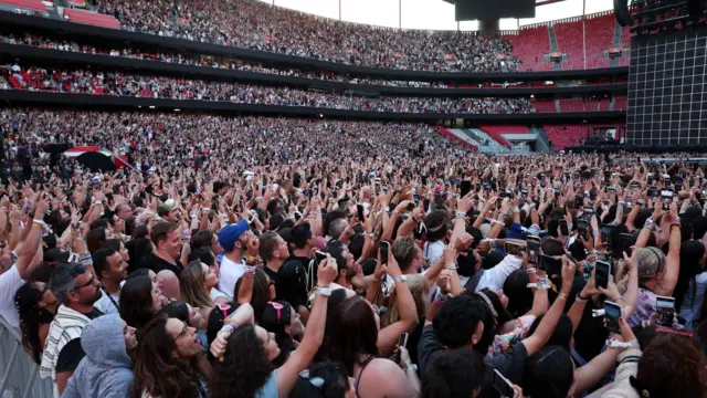 Fans cheer during a concert by American singer-songwriter Taylor Swift at Luz Stadium in Lisbon, Portugal, May 24, 2024.