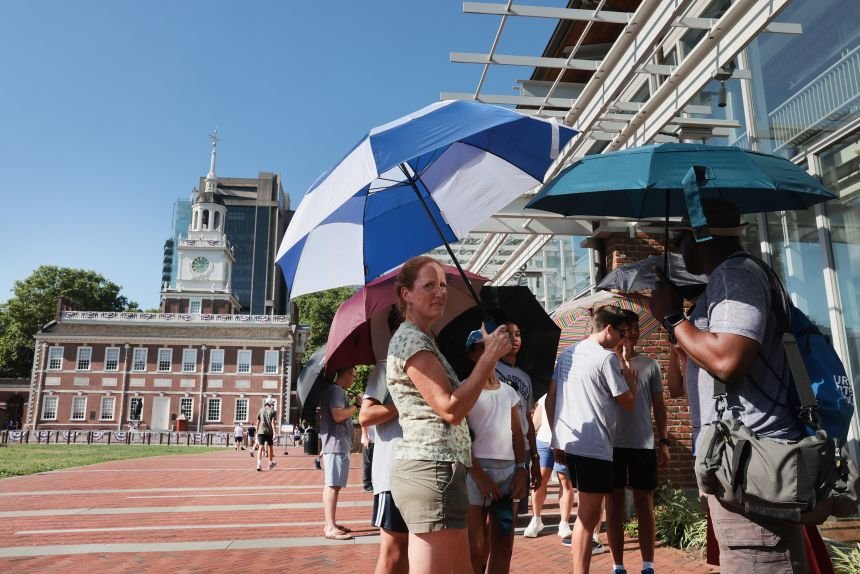 People gather outside Independence Hall in Philadelphia during a heatwave on Friday, July 3.