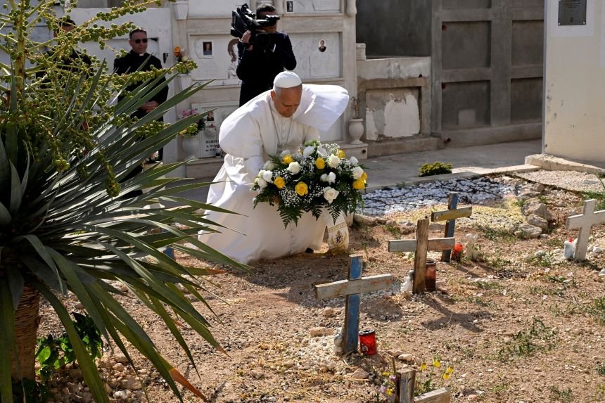 Pope Leo lays flowers at the Lampedusa cemetery, on the grave of little Youssef, during his pastoral visit to the island in southern Italy, July 4, 2026.