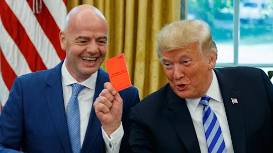Folarin Balogun's red card controversy: Why Donald Trump's intervention in the World Cup decision highlights double standards 20 President Donald Trump holds a red card during a meeting with FIFA President Gianni Infantino in the Oval Office in 2018.