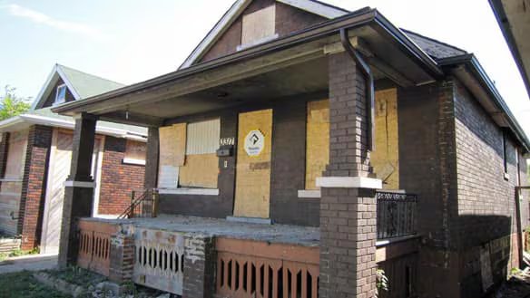 Boarded up empty house