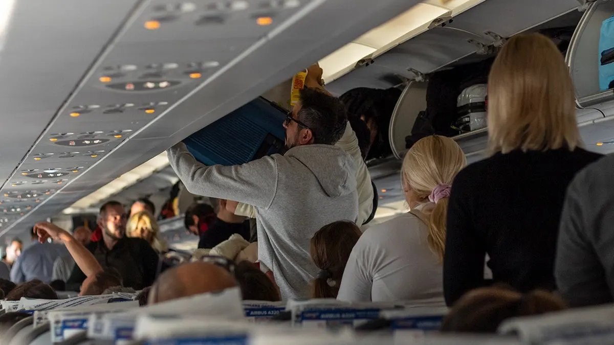 Passengers board the plane