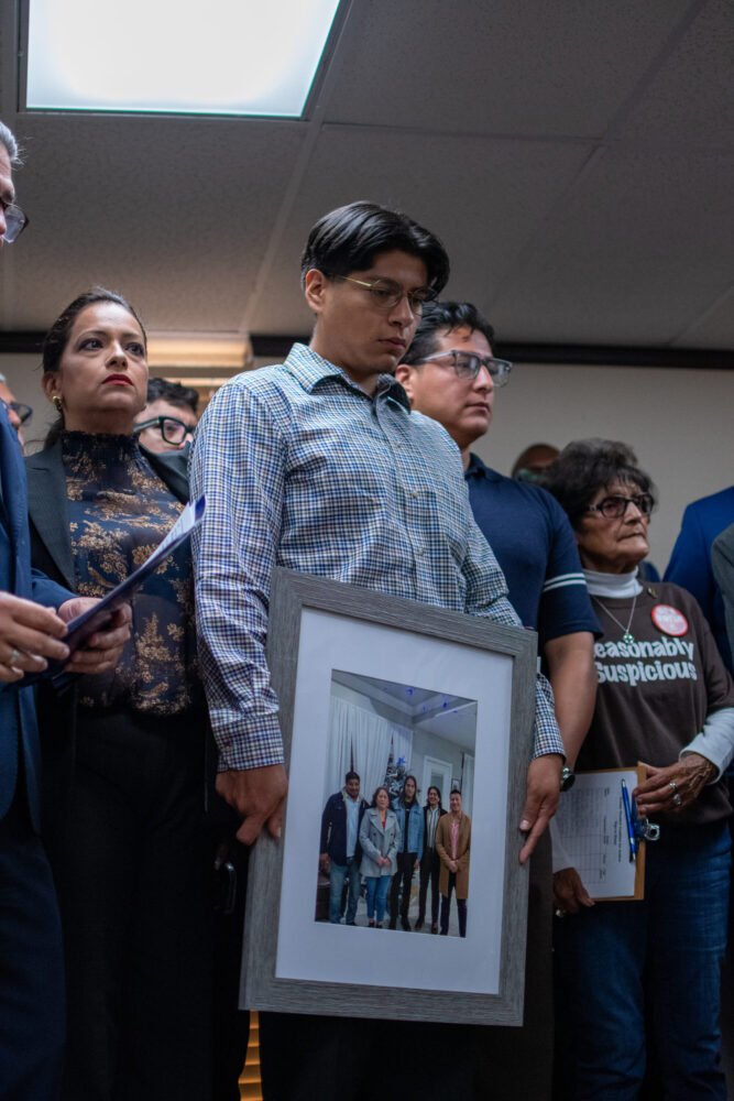 Relatives of Houston man fatally shot by ICE agent describe him as 'hard-working family man' - Houston Public Media 14 Middle son Lorenzo Salgado Araujo holds a photo of his father, who was shot and killed by ICE. July 8, 2026