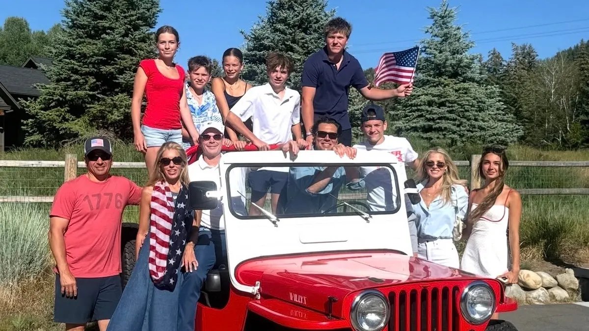 Ali Larter Celebrates the Fourth of July with a Mountain Getaway in Idaho 20 Ali Larter poses with family and friends dressed in red, white and blue next to a red Jeep during a Fourth of July celebration in the mountains.