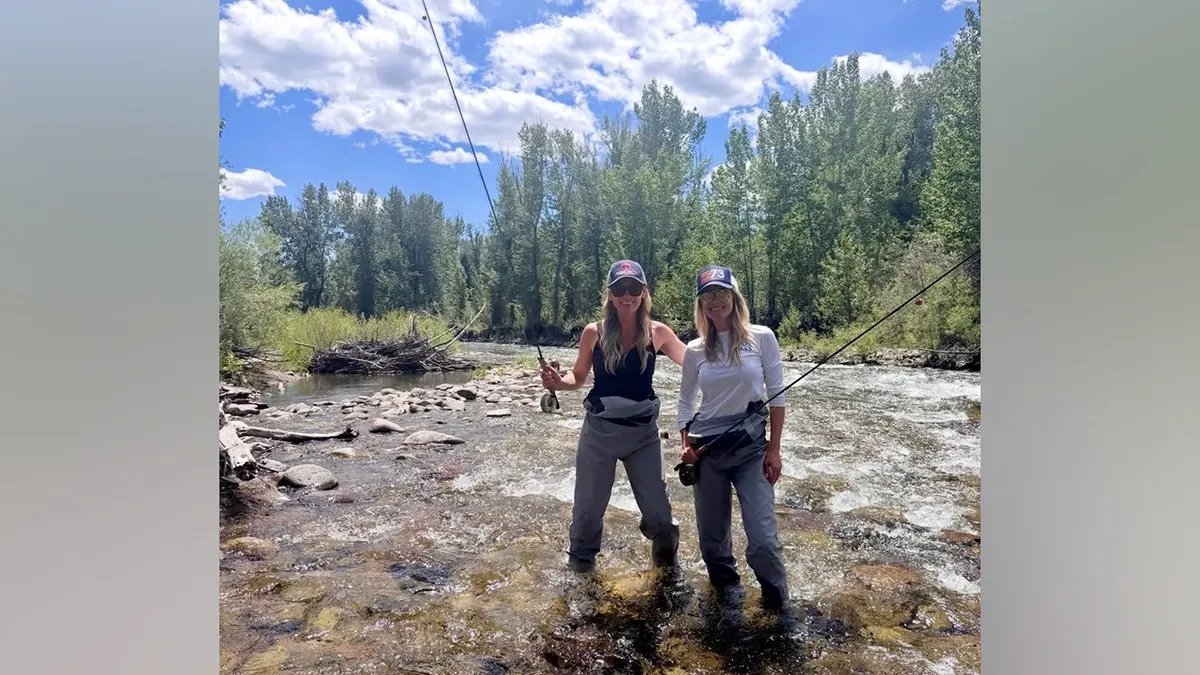 Ali Larter Celebrates the Fourth of July with a Mountain Getaway in Idaho 18 Eli Larter stands in a mountain river wearing waders and holding a fishing rod next to a friend during a Fourth of July vacation.