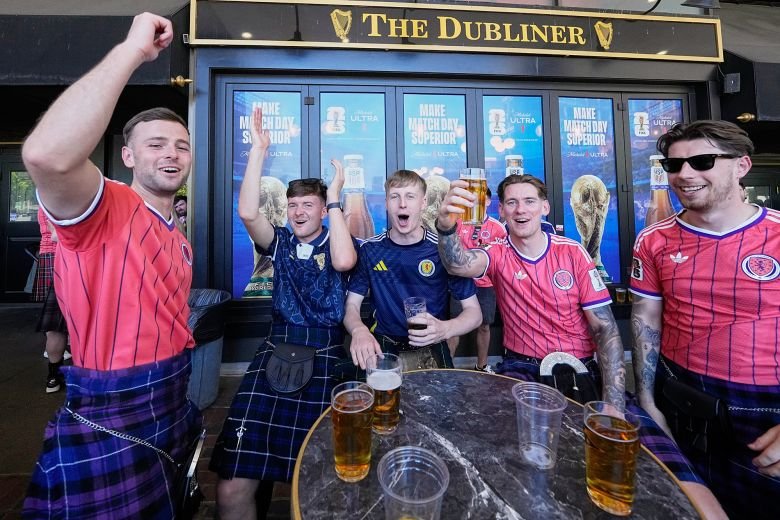 The USA and Mexico are not participating in the World Cup. Ticket prices are falling 15 Scottish fans drink and sing at a pub in downtown Boston last month.