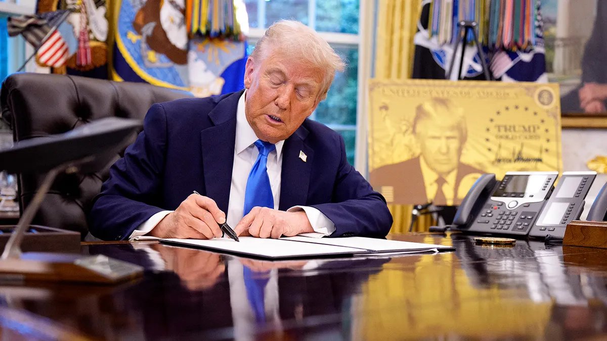 Microsoft approves thousands of H-1B visas while Xbox cuts 1,600 jobs 15 President Donald Trump sits in the Oval Office and signs executive orders.