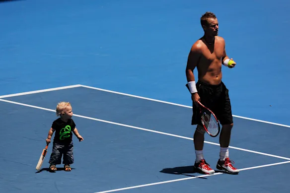 Cruise Hewitt with his father Lleyton Hewitt during training at the 2010 Australian Open.