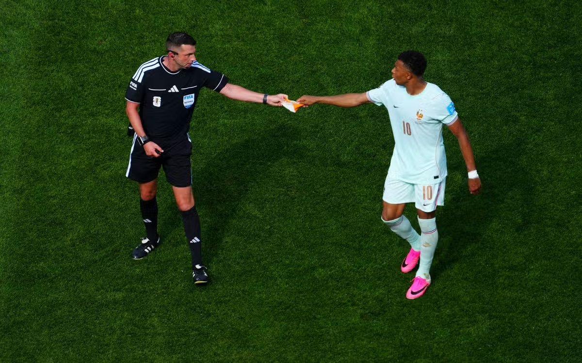 Kylian Mbappe of France presents referee Michael Oliver with the captain's armband after being substituted Norway - France, 2026 FIFA World Cup Group I, Soccer, Boston Stadium, Foxborough, Massachusetts, USA - June 26, 2026