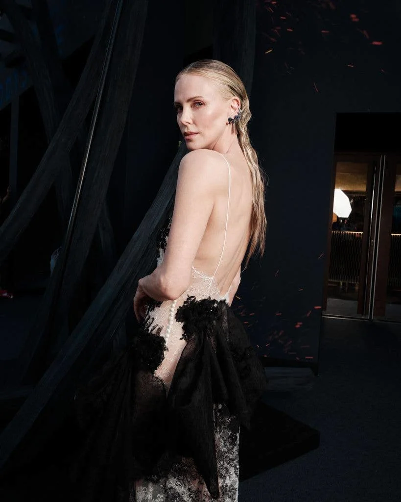 Charlize Theron, 50, stunned in a plunging lace dress on the red carpet 15 Dior's stunning creation was backless.