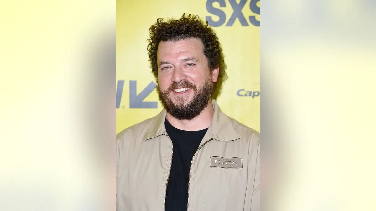 Danny McBride smiles