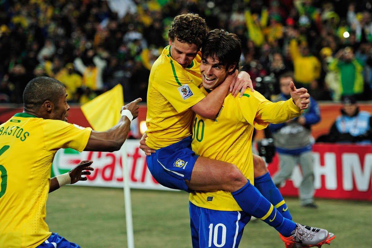 Kaka (right) celebrates with his teammates during a 2010 World Cup game in Johannesburg, South Africa.
