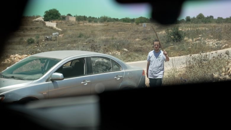 West Bank: Israeli settlers attack journalists, including CNN 17 A settler approaches journalists' cars near the village of Sinjil, north of Ramallah.
