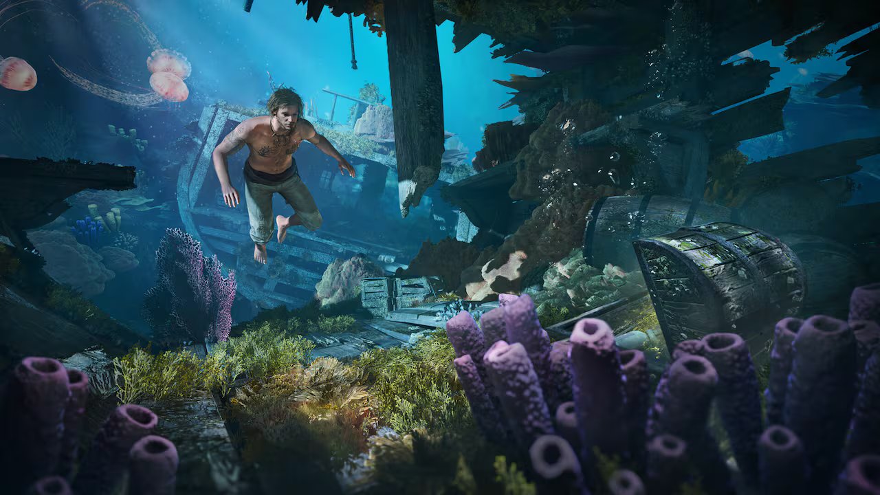 A video game screenshot of a man swimming underwater, looking at corals and treasure chests among the wreckage of a sunken ship.