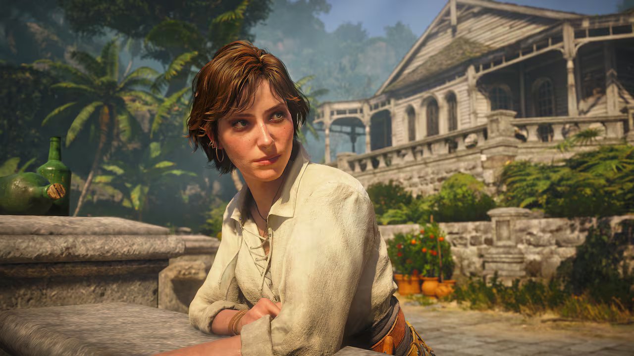 Video game screenshot of a female pirate with short red hair in front of an old manor.