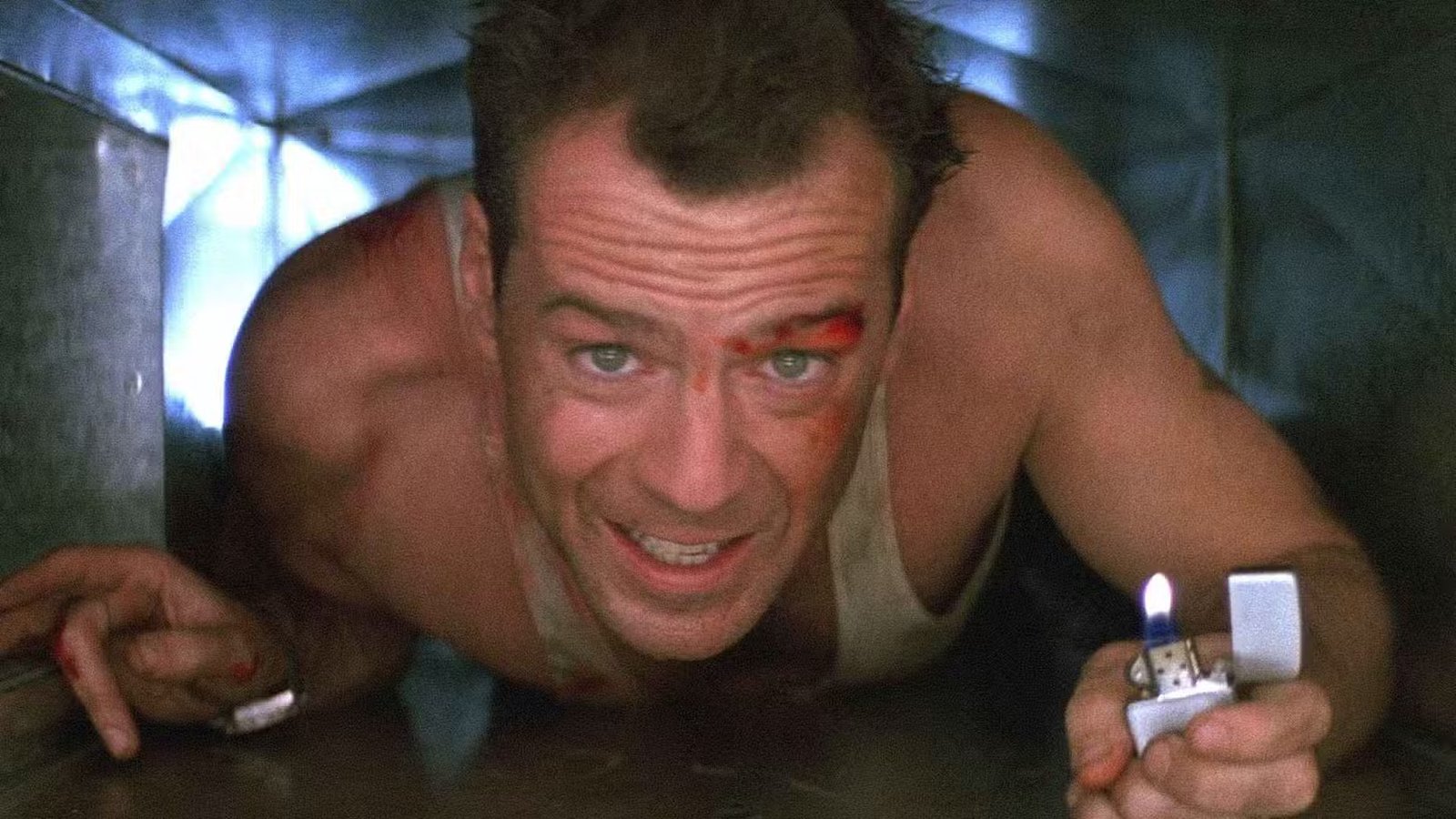 Bruce Willis as John McClane crawling through air ducts in Die Hard