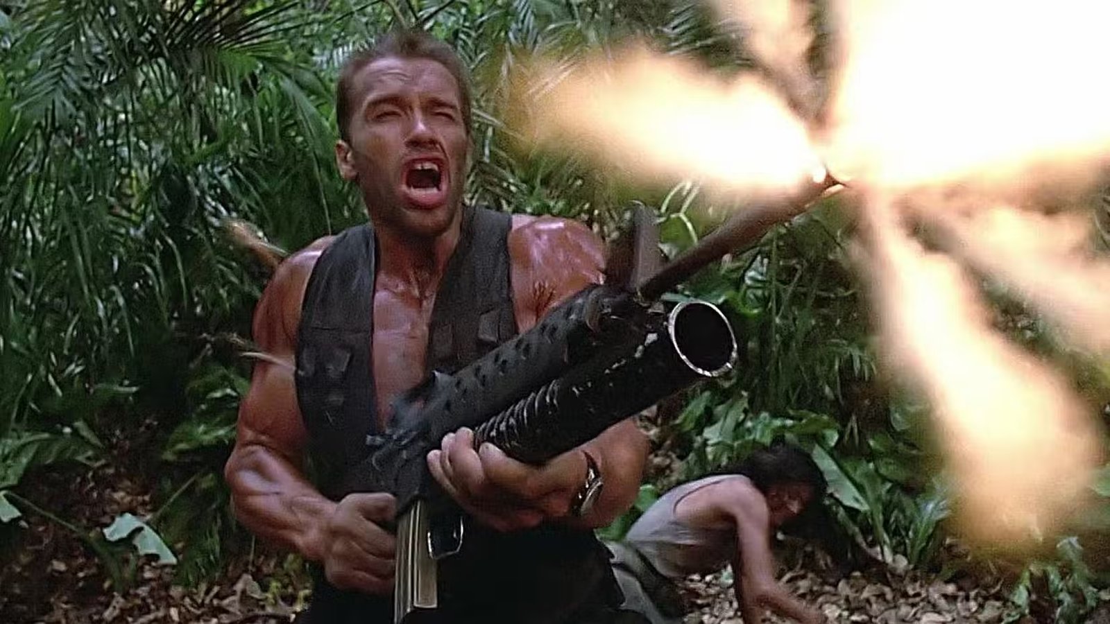Dutch (Arnold Schwarzenegger) shoots an M-16 in Predator (1987)