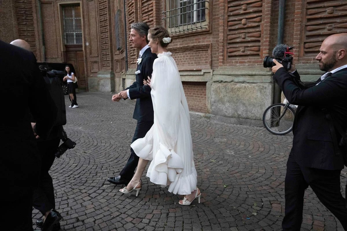 Eva Herzigova wore a boho Lanvin midi wedding dress to the ceremony at Turin's Church of San Vito.
