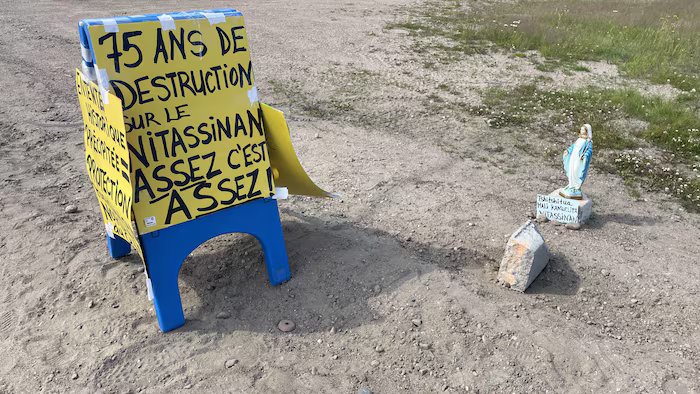 Poster against the destruction of the ancestral territory of the Innu Pessamit.