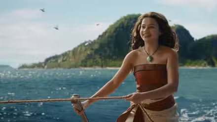 Katherine Lagaaia as Moana in the 2026 live action film Moana, standing on the deck of a ship at sea.