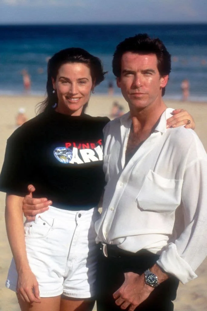 Keely Shay and Pierce Brosnan on the beach in the 90s