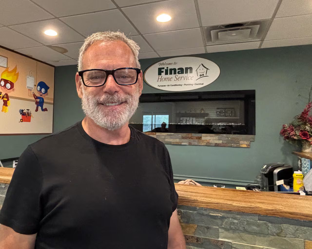 John Finan, owner of Finan Home Services, stands in the lobby of his company's London, Ontario office.