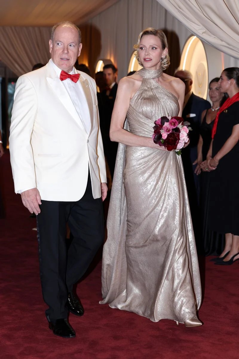 Princess Charlene shines at the Red Cross Ball in Monaco in a stunning gold dress that combines Bond girl glamor with diamonds and Old Hollywood waves.
