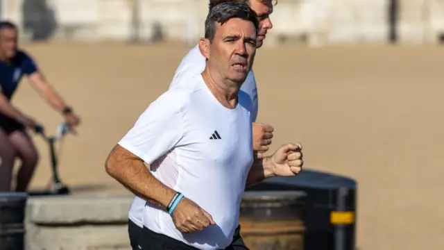 Burnham running in a white T-shirt