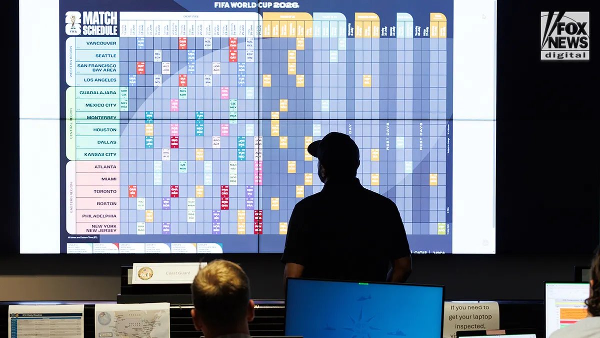 Kash Patel looks at the monitor with the 2026 World Cup schedule.