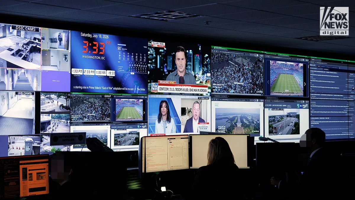 A room at FBI headquarters showing Fox News on the screen.