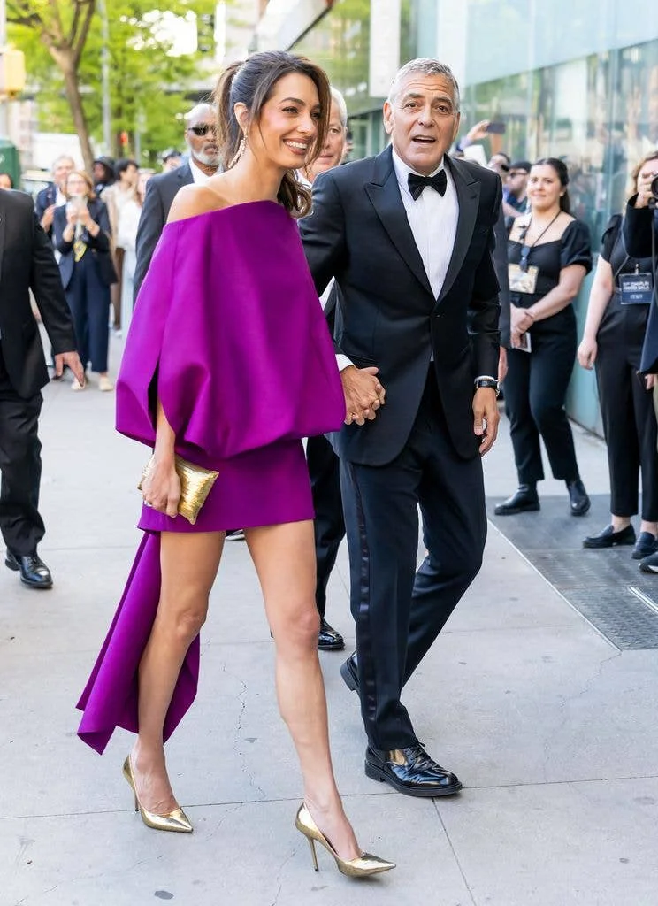 Amal in a purple minidress on a walk with George in a suit