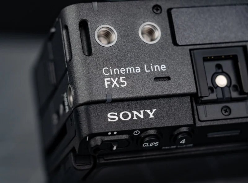 Sony FX5 has a new sensor, open shutter, internal RAW and more 23 Close-up of the black Sony Cinema Line FX5 camera body, showing the brand name, model label, and some of the input ports and controls.