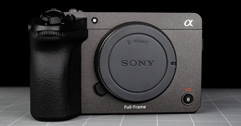 Sony FX5 has a new sensor, open shutter, internal RAW and more 24 Close-up of the Sony Alpha full-frame mirrorless camera body without the lens attached, showing the E-mount and various control buttons on a gray grid-patterned surface.