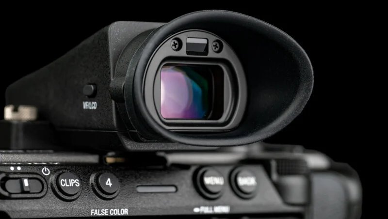 Sony FX5 has a new sensor, open shutter, internal RAW and more 29 Close-up of the electronic viewfinder and control buttons of a digital camera: reflections of the lens and detailed texture of the camera body on a black background.