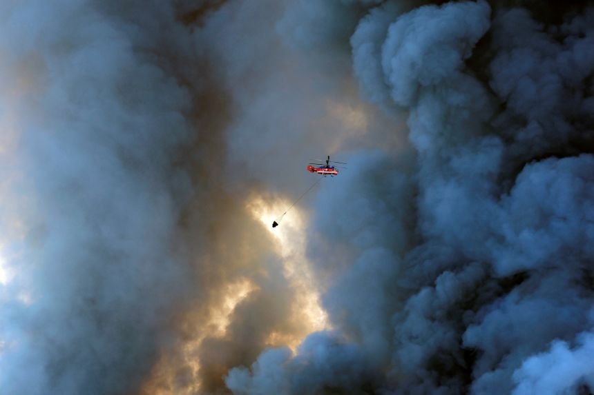 'Up in Smoke': Attacks on the 'Russian Amazon' Bring Putin's War Closer to Home 15 A firefighting helicopter attempts to extinguish a fire at the logistics complexes of Russian e-commerce company Wildberry in the town of Elektrostal near Moscow on July 18.