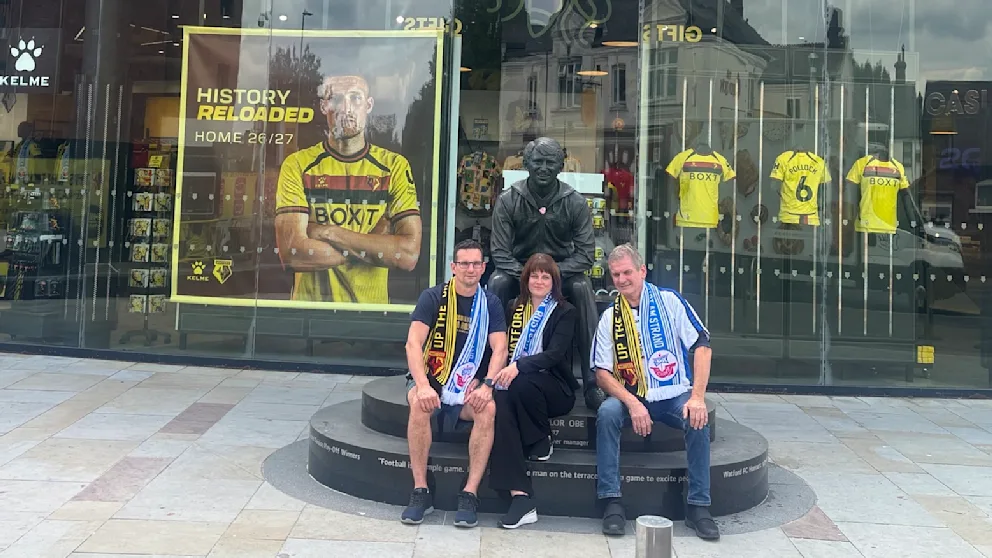 Lutz Barthel (right) with scarves in front of the Watford fan shop.