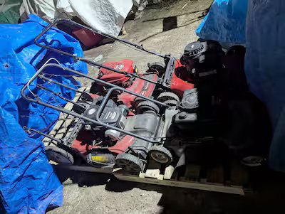 (PHOTOS) This trash collector collects the treasures you throw in the trash. 22 He even collects lawn mowers, like the one in this photo.